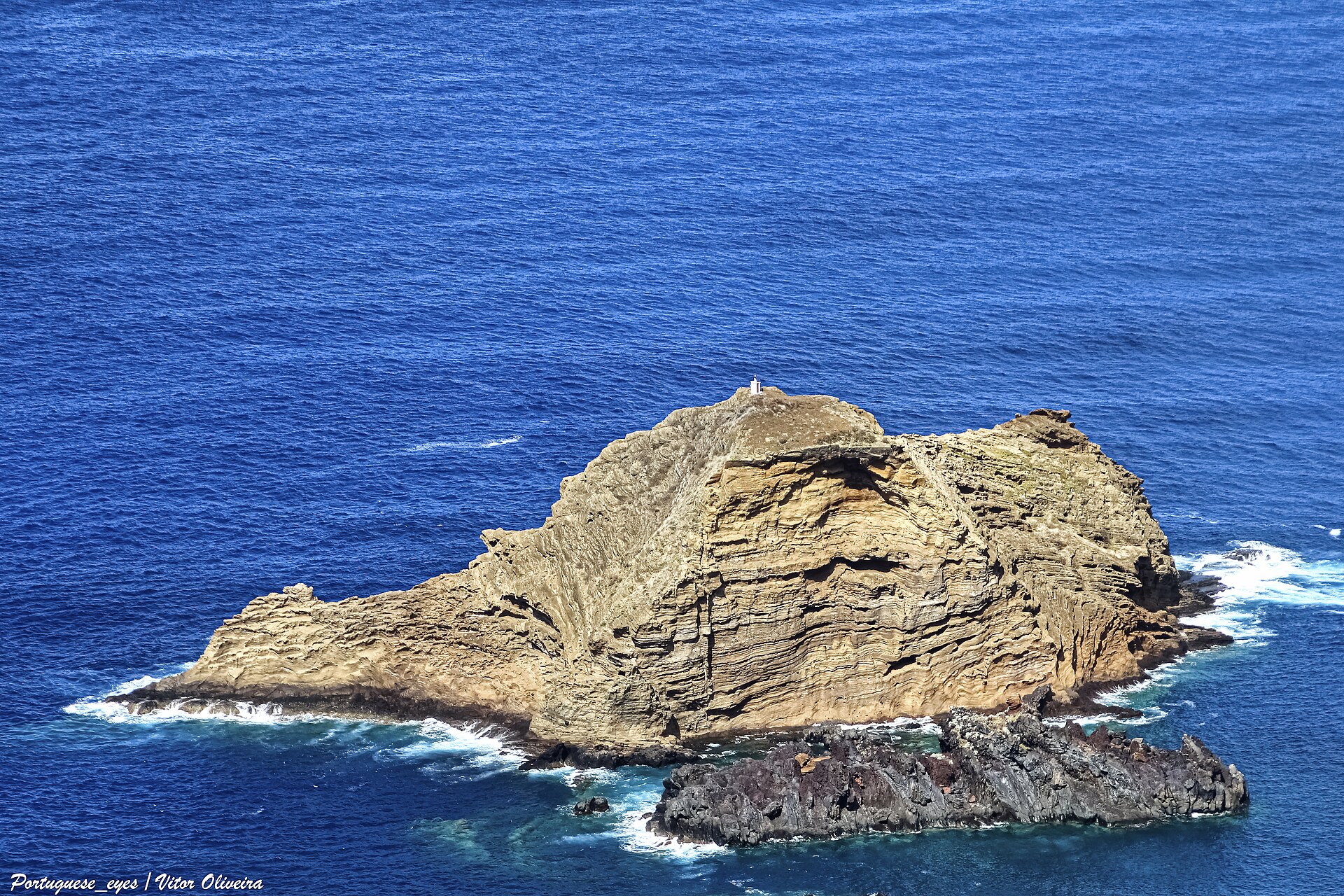 Ilhéu Mole islet with lighthouse off Porto Moniz, Madeira